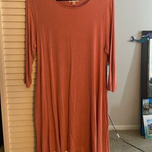 It’s a pink long sleeve dress it’s a size small.